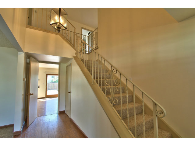 22675 Coleta Drive Salinas, CA 93908 - Photo 3 of 23 a view of a living room and a bathroom with wooden floor