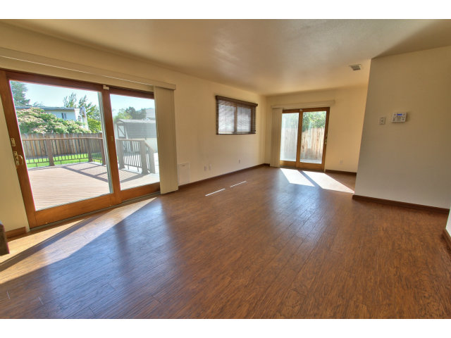 22675 Coleta Drive Salinas, CA 93908 - Photo 6 of 23 a view of an empty room with wooden floor and a window