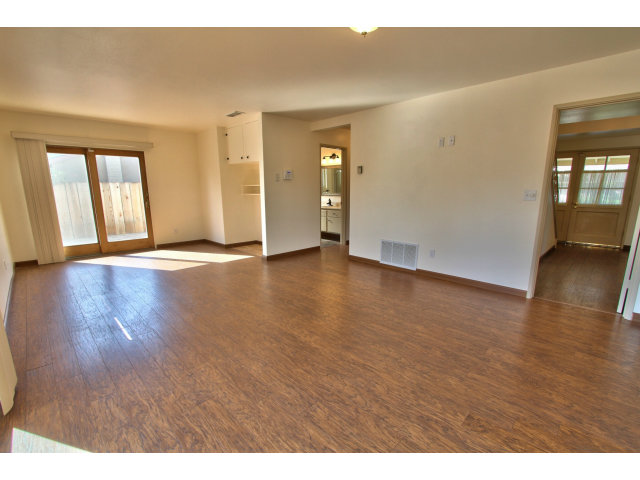 22675 Coleta Drive Salinas, CA 93908 - Photo 7 of 23 a view of an empty room with window and wooden floor