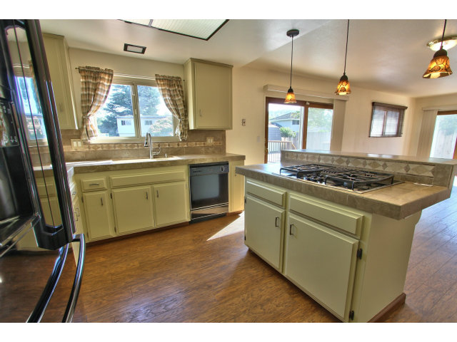 22675 Coleta Drive Salinas, CA 93908 - Photo 10 of 23 a kitchen with stainless steel appliances granite countertop a sink stove and refrigerator
