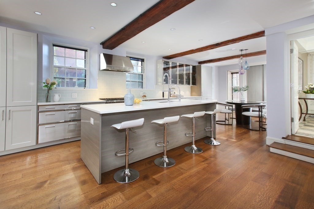 14 Walnut Street Boston, MA 02108 - Photo 13 of 42 a kitchen with stainless steel appliances granite countertop a sink and cabinets