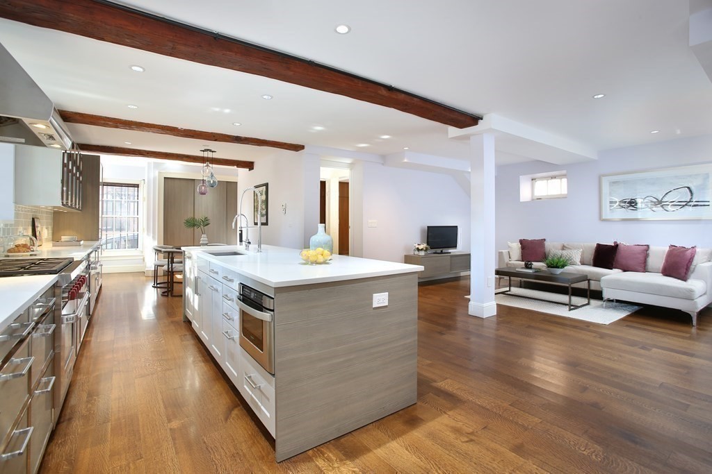 14 Walnut Street Boston, MA 02108 - Photo 16 of 42 a large living room with stainless steel appliances granite countertop lots of counter top space and furniture