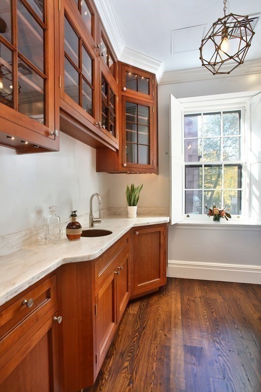 14 Walnut Street Boston, MA 02108 - Photo 21 of 42 a kitchen with a sink and cabinets
