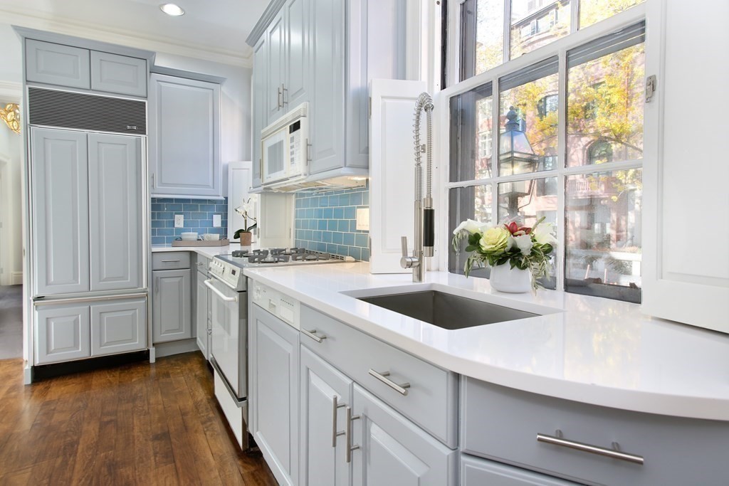 14 Walnut Street Boston, MA 02108 - Photo 23 of 42 a kitchen with a sink and a refrigerator
