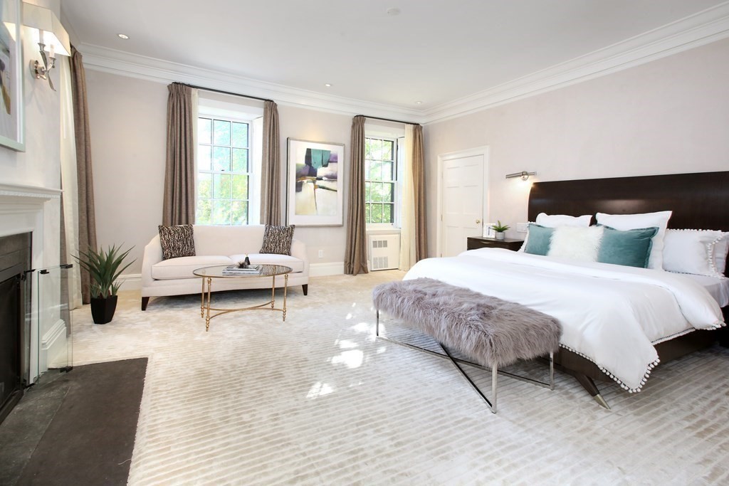 14 Walnut Street Boston, MA 02108 - Photo 24 of 42 a bedroom with a bed a couch and a large window