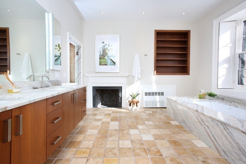 14 Walnut Street Boston, MA 02108 - Photo 26 of 42 a spacious bathroom with a double vanity sink a mirror and a bathtub