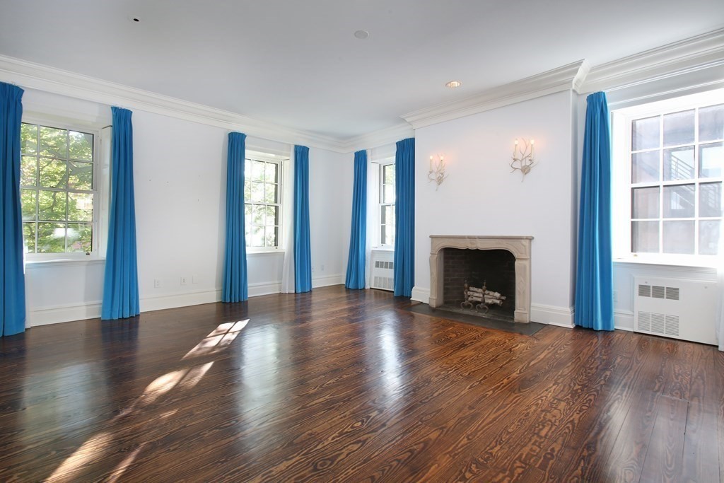14 Walnut Street Boston, MA 02108 - Photo 30 of 42 a view of a livingroom with wooden floor and a fireplace