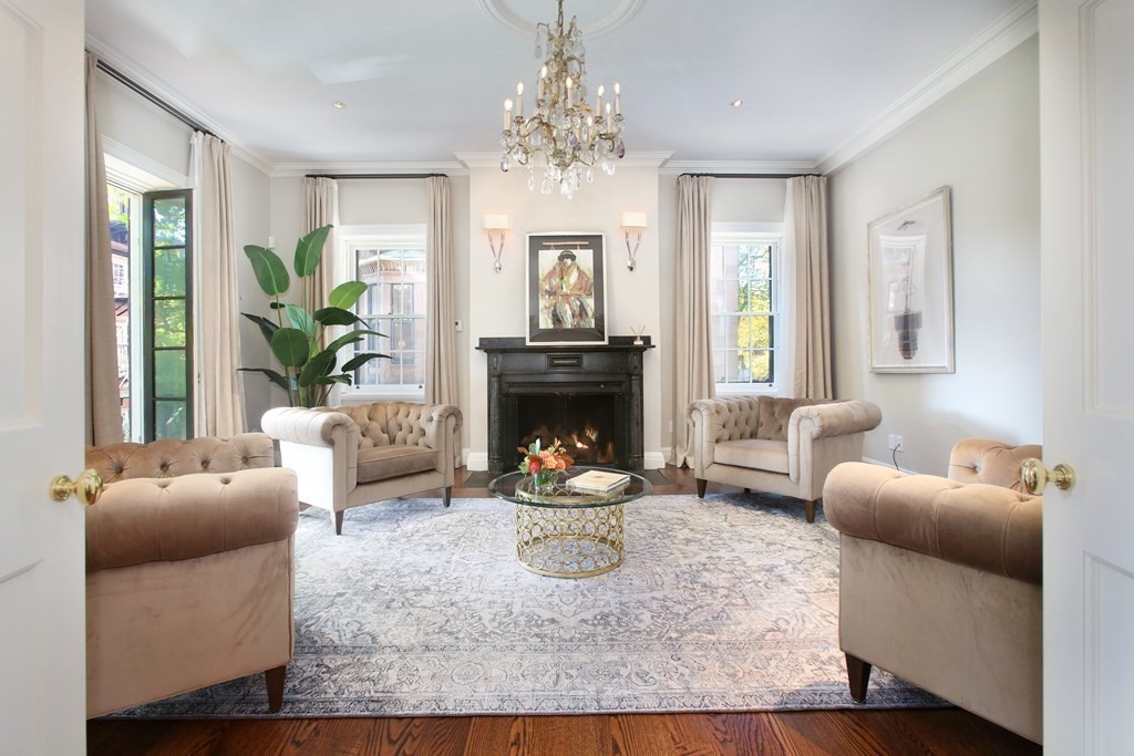 14 Walnut Street Boston, MA 02108 - Photo 3 of 42 a living room with furniture a fireplace and a chandelier