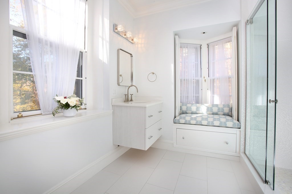 14 Walnut Street Boston, MA 02108 - Photo 31 of 42 a bathroom with a double vanity sink and a bathtub