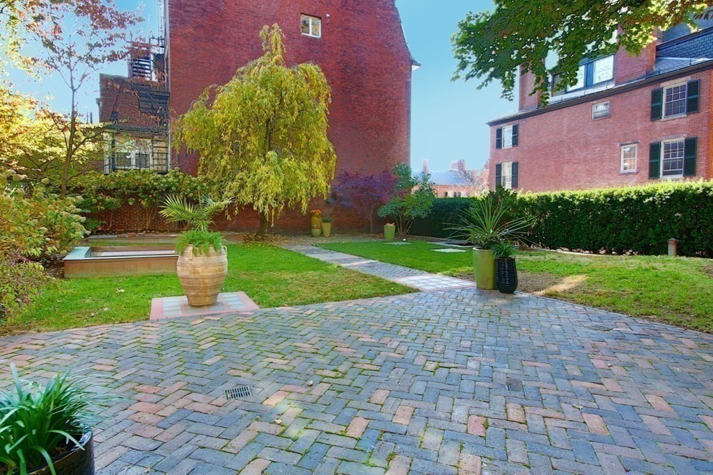 14 Walnut Street Boston, MA 02108 - Photo 39 of 42 a view of a house with a yard and plants