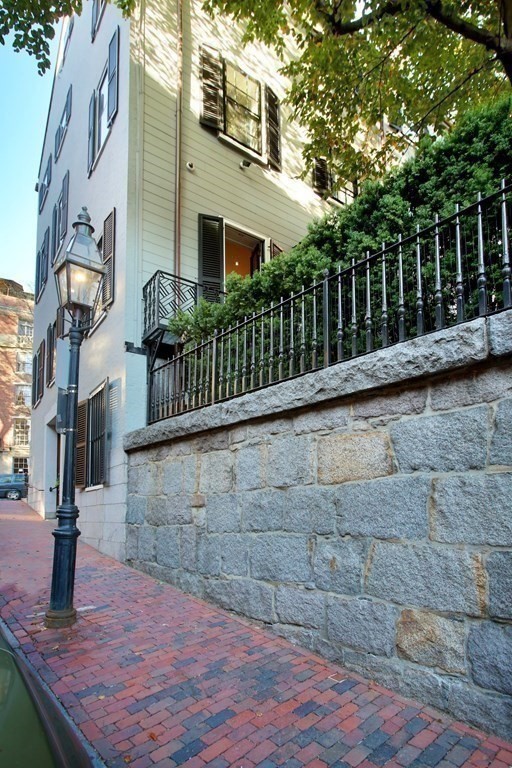 14 Walnut Street Boston, MA 02108 - Photo 42 of 42 a view of a house with brick wall and plants