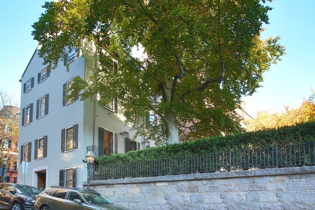 14 Walnut Street Boston, MA 02108 - Photo 10 of 42 a front view of a house with a garden