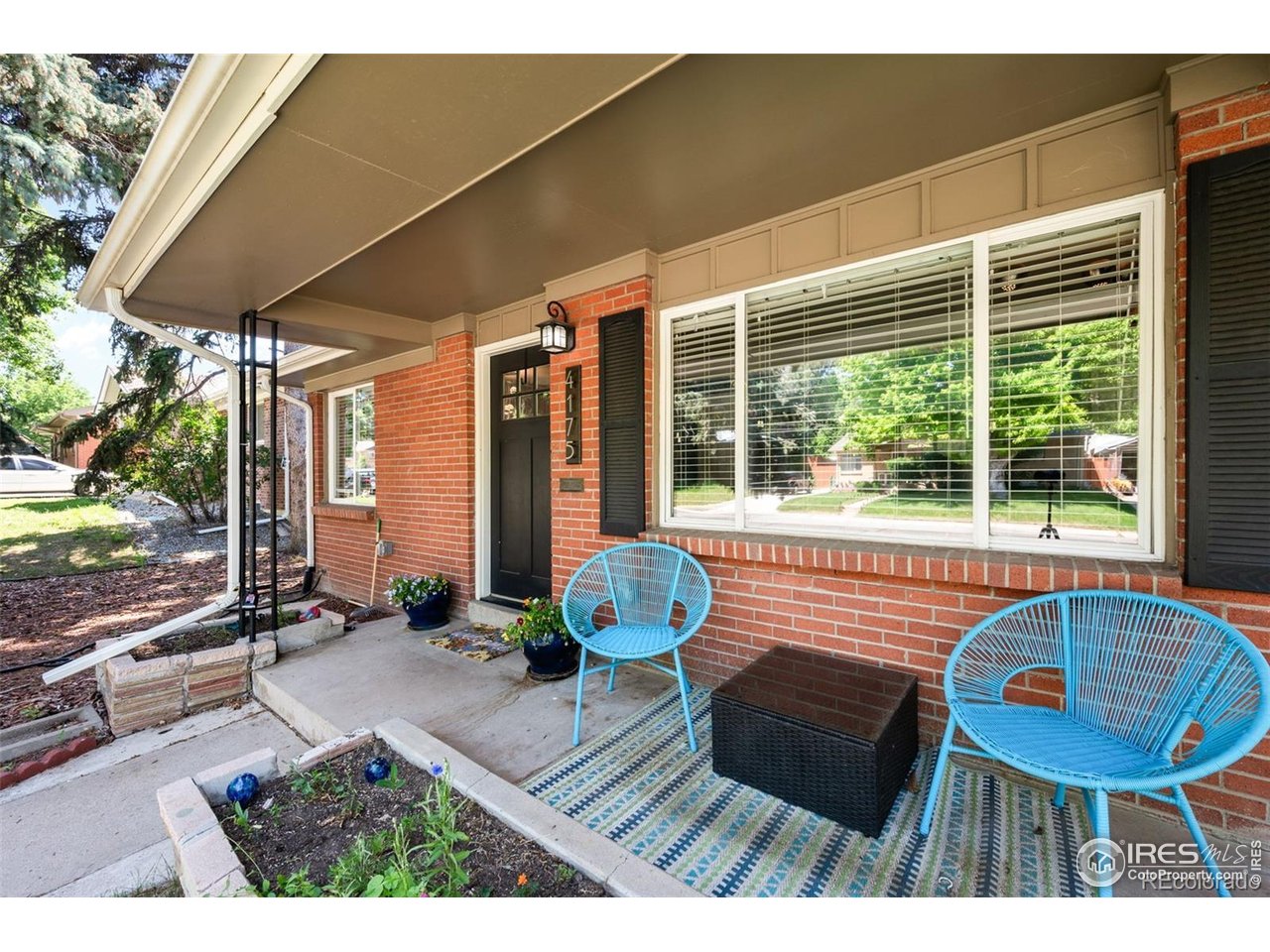 4175 South Inca Street Englewood, CO 80110 - Photo 2 of 29 a view of balcony with couch and outdoor seating