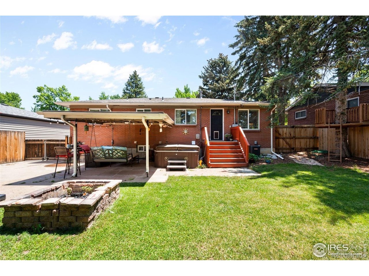 4175 South Inca Street Englewood, CO 80110 - Photo 22 of 29 a view of a house with backyard porch and sitting area
