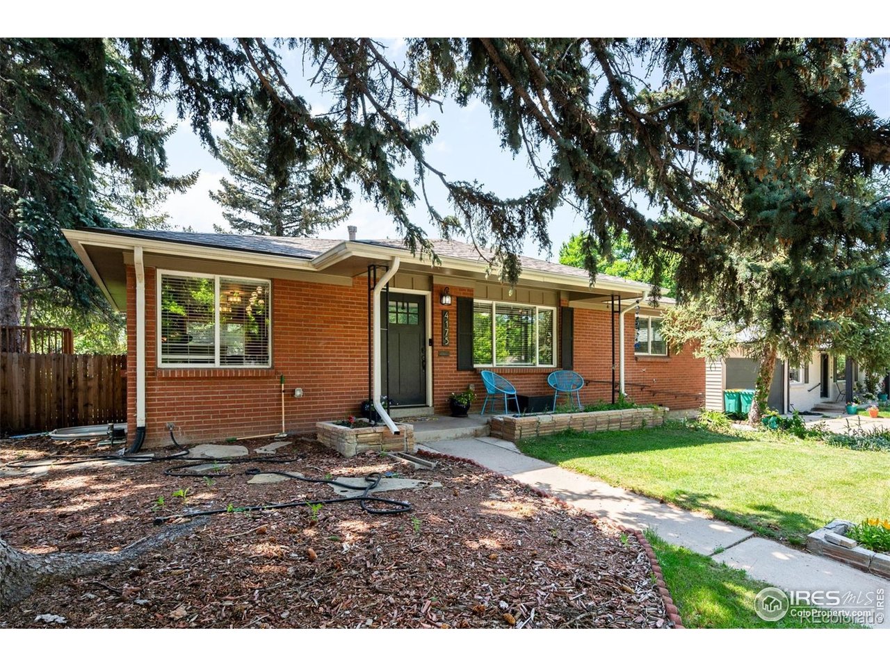 4175 South Inca Street Englewood, CO 80110 - Photo 3 of 29 a view of a house with backyard and a tree