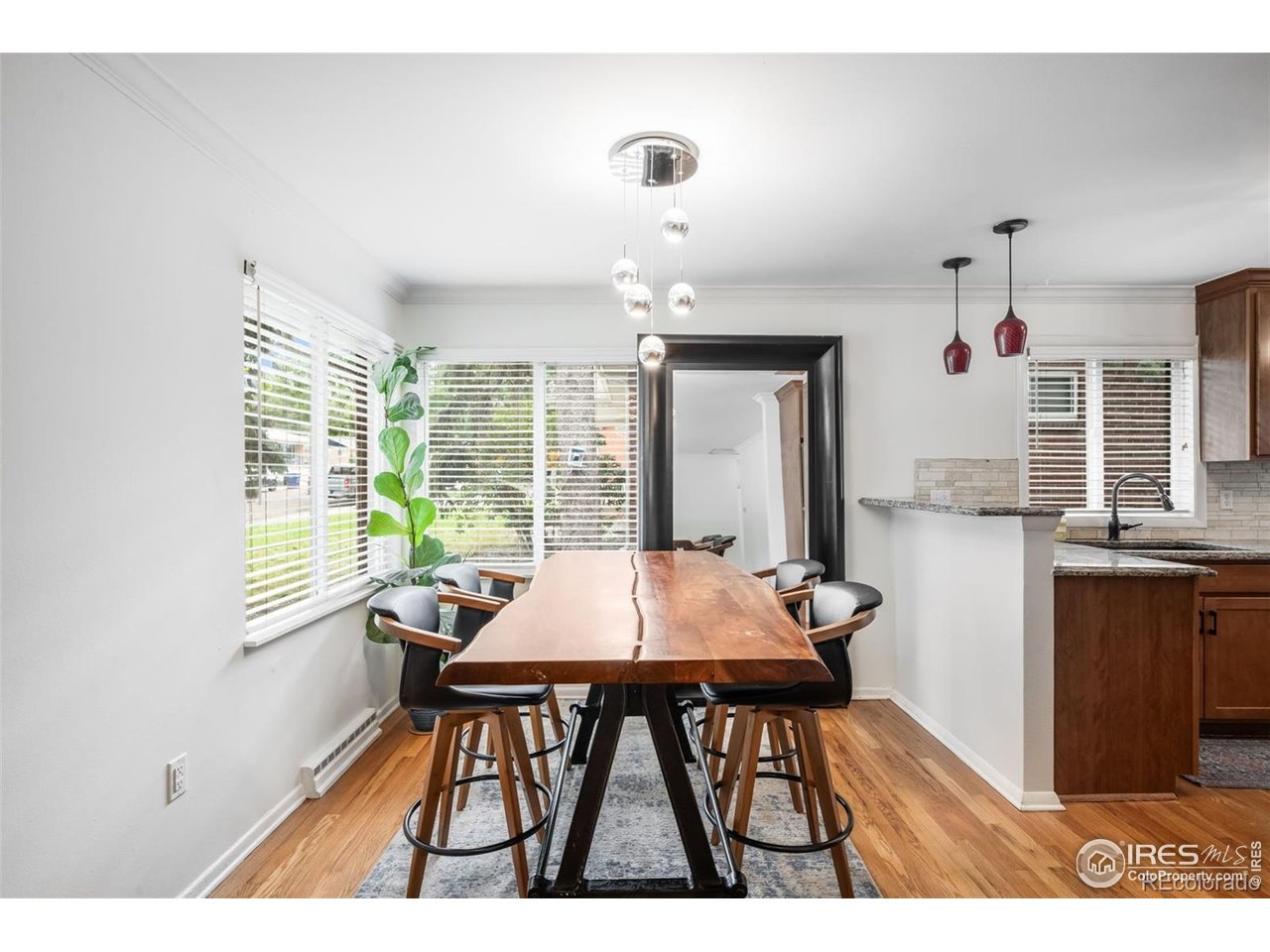 4175 South Inca Street Englewood, CO 80110 - Photo 8 of 29 a view of a dining room with furniture window and outside view