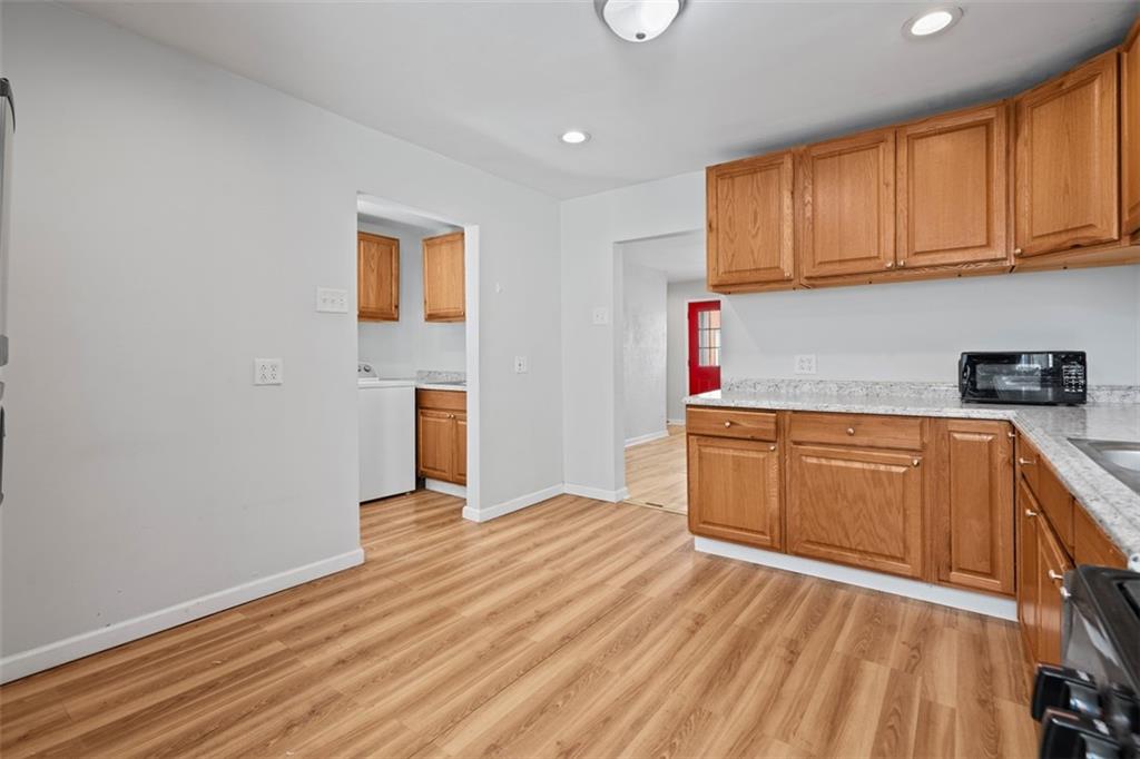 519 3rd Avenue Carnegie, PA 15106 - Photo 14 of 36 a kitchen with wooden floors and cabinets