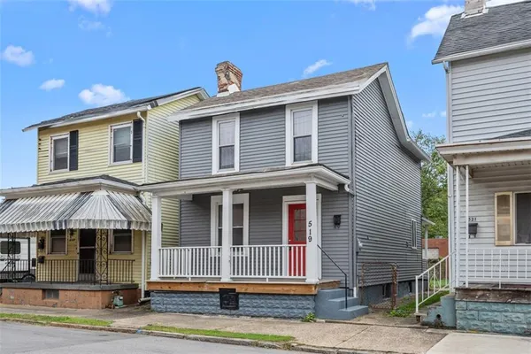 a front view of a house with a porch