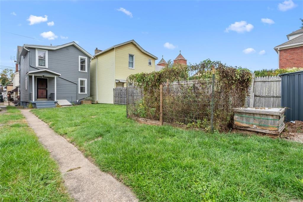 519 3rd Avenue Carnegie, PA 15106 - Photo 29 of 36 a view of a house with a big yard and large trees
