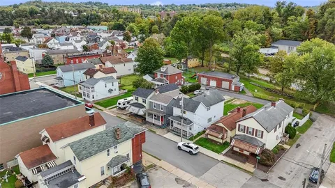 an aerial view of a house with a garden