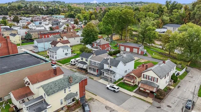 an aerial view of a house with a garden