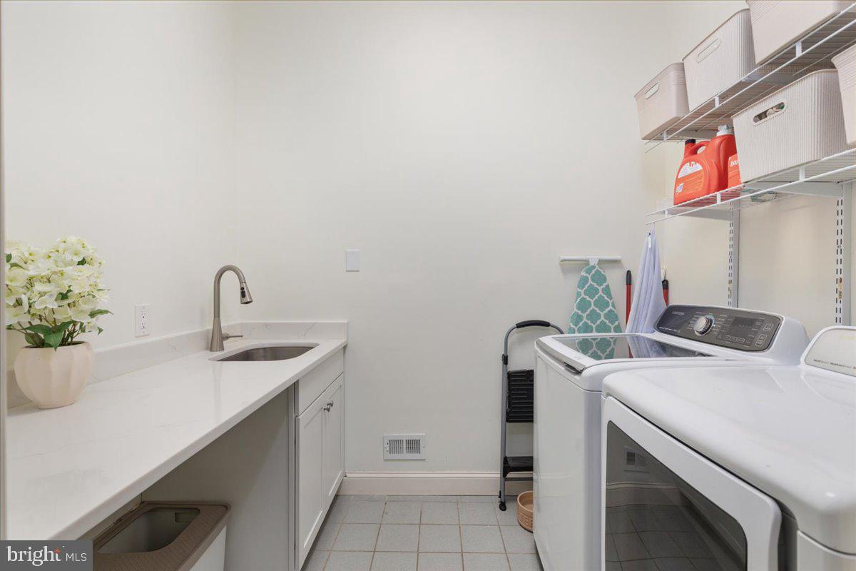 14915 Alpine Bay Loop Gainesville, VA 20155 - Photo 32 of 105 a utility room with dryer and washer