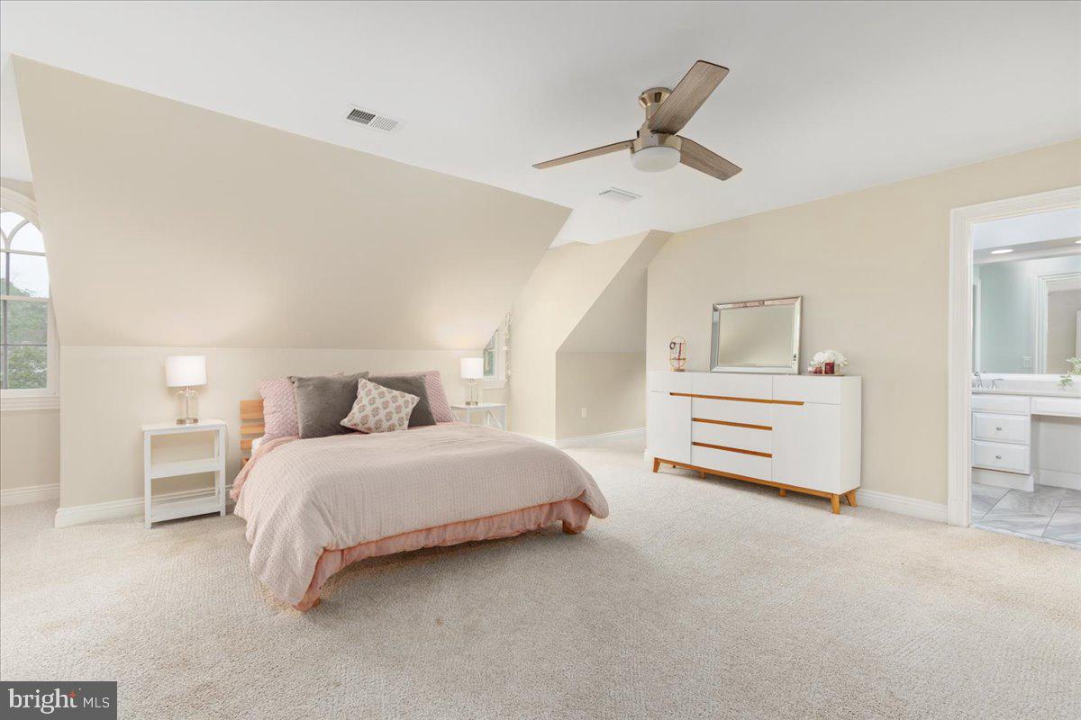 14915 Alpine Bay Loop Gainesville, VA 20155 - Photo 37 of 105 a spacious bedroom with a bed and cabinets