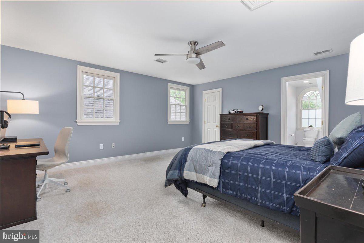 14915 Alpine Bay Loop Gainesville, VA 20155 - Photo 42 of 105 a bedroom with a bed and wooden floor