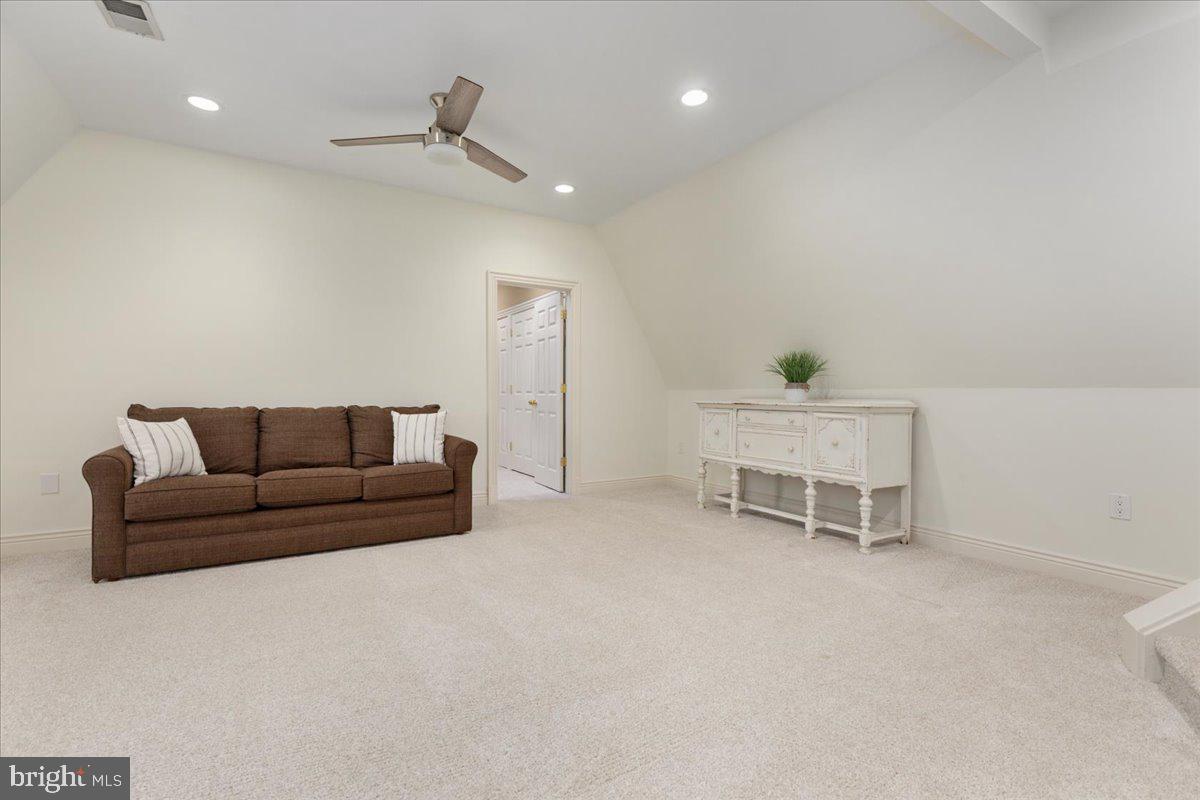 14915 Alpine Bay Loop Gainesville, VA 20155 - Photo 49 of 105 a living room with furniture and a ceiling fan