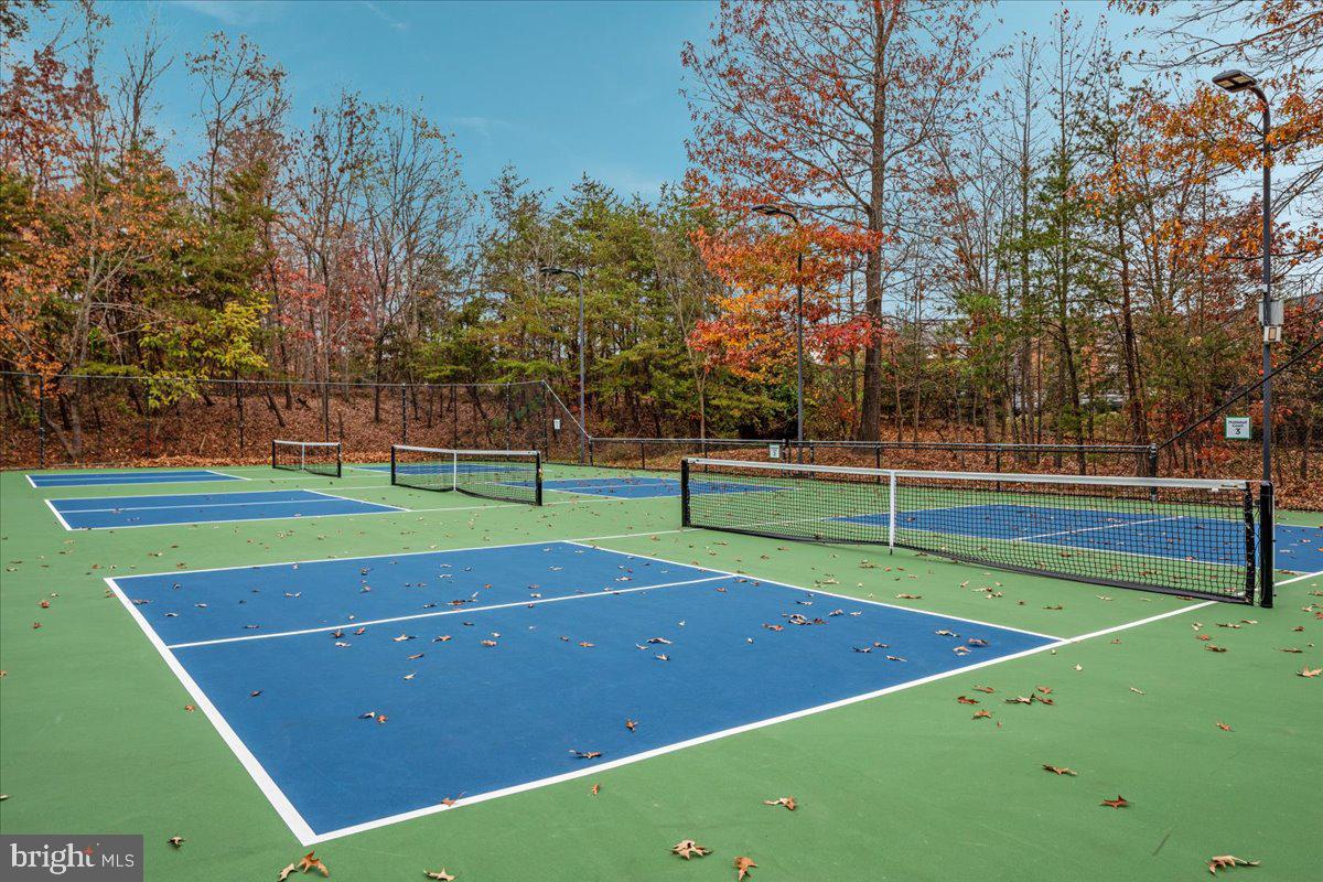 14915 Alpine Bay Loop Gainesville, VA 20155 - Photo 100 of 105 a view of an outdoor space and tennis court