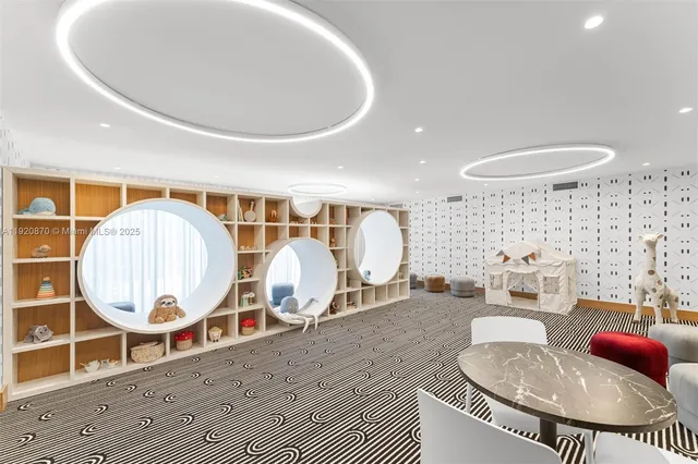 a living room with a couch and a dining table