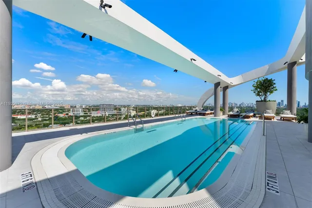 a view of swimming pool from a balcony