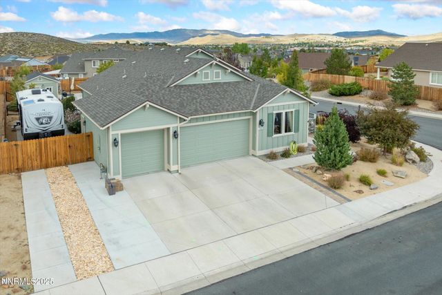 aerial view of a house with a yard