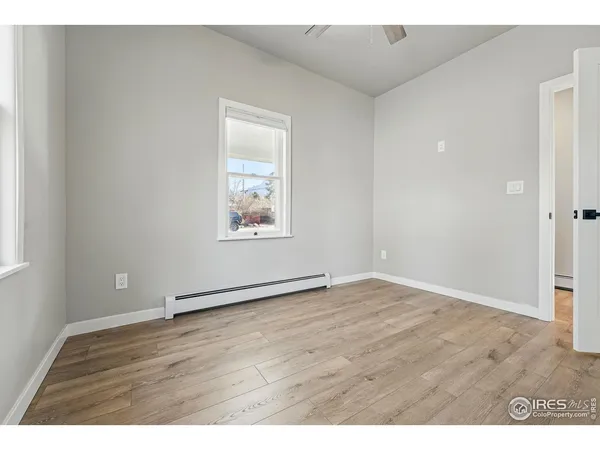 a view of a backyard and floor to ceiling window