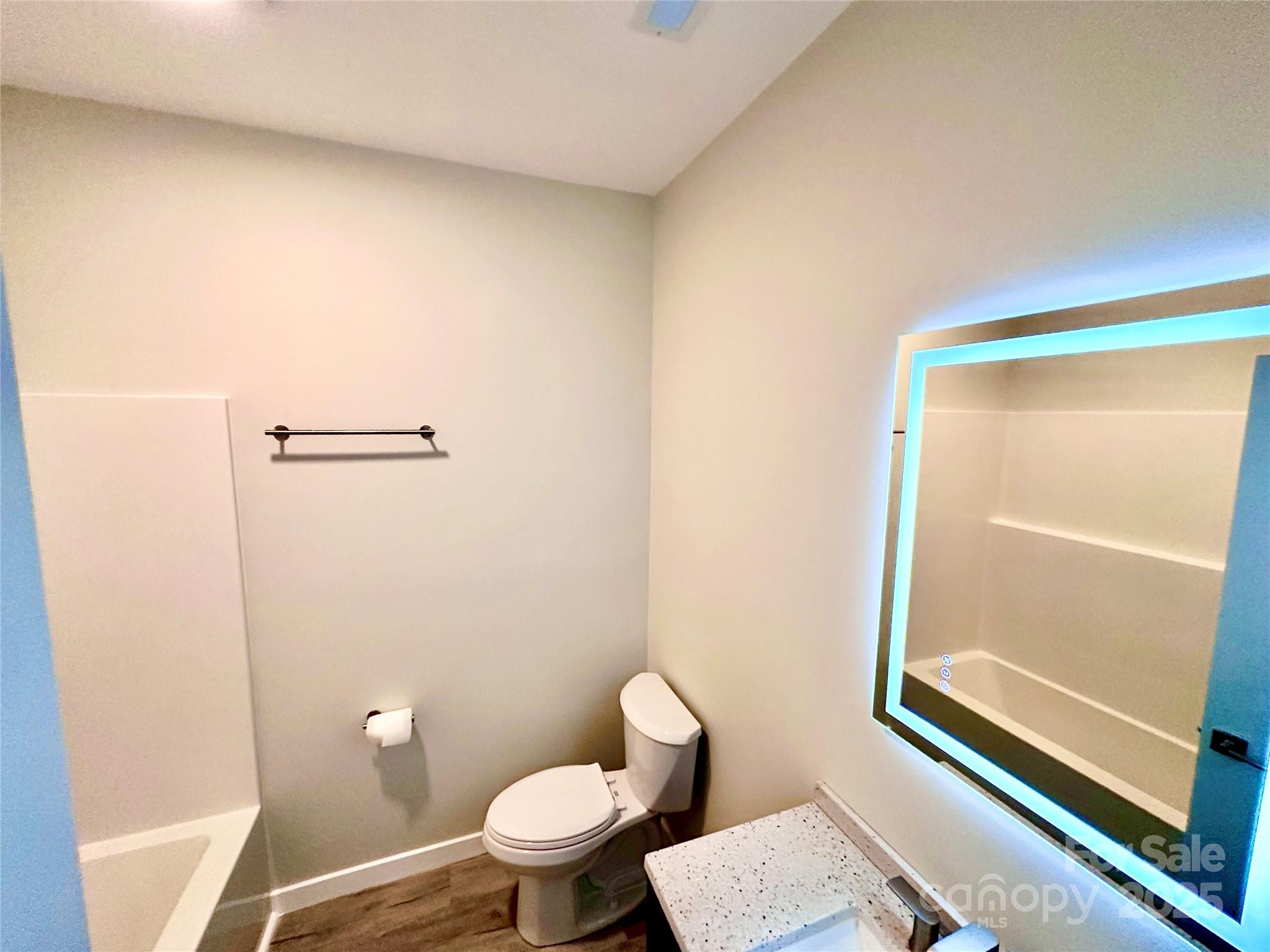 1171 Peach Orchard Road Jefferson, SC 29718 - Photo 12 of 30 a white toilet sitting next to a shower