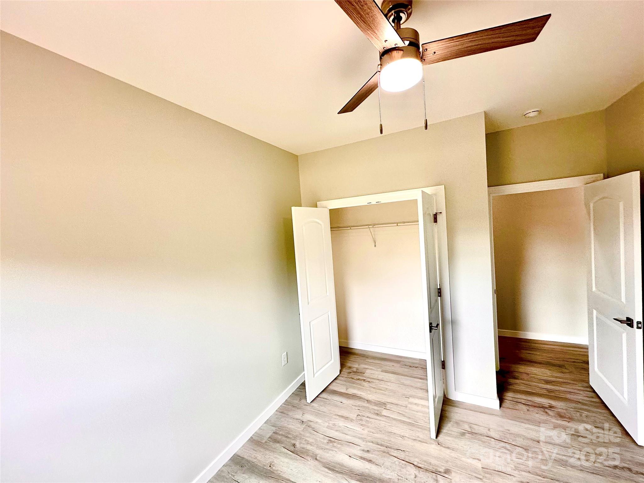 1171 Peach Orchard Road Jefferson, SC 29718 - Photo 14 of 30 a view of a hallway with wooden floor