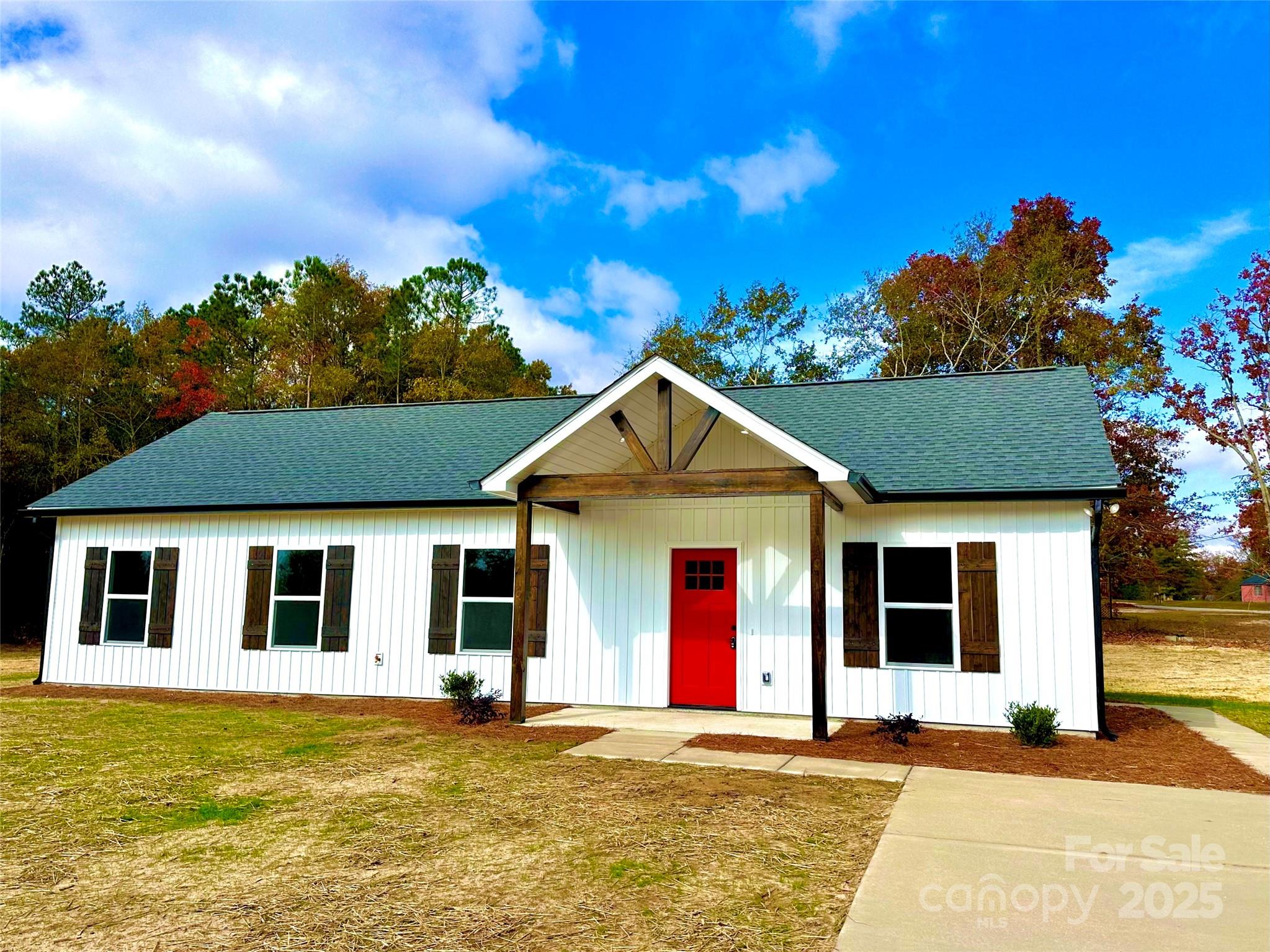 1171 Peach Orchard Road Jefferson, SC 29718 - Photo 28 of 30 a view of a house with a swimming pool and a fire pit