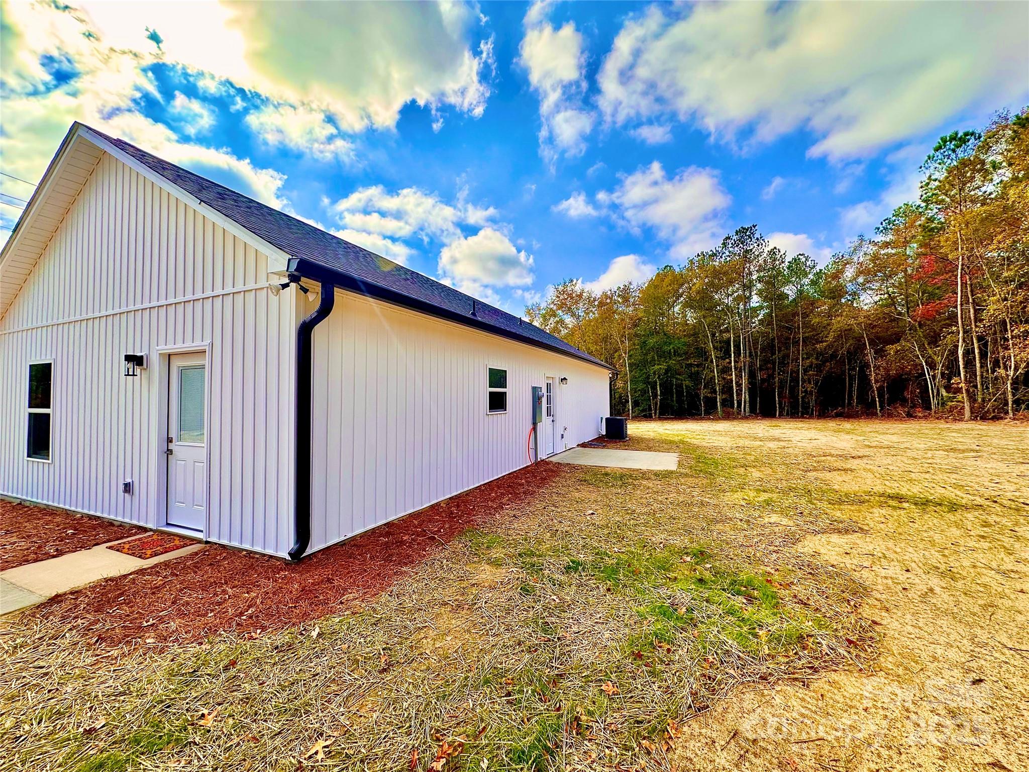 1171 Peach Orchard Road Jefferson, SC 29718 - Photo 30 of 30 a view of a house with backyard and tree