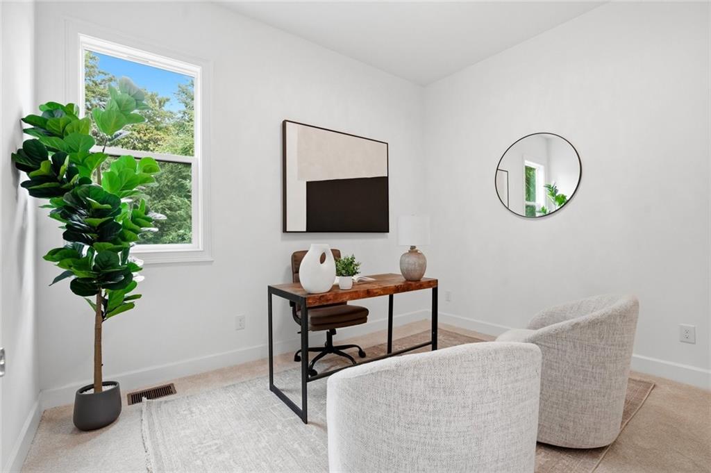 2415 West Rugby Avenue Atlanta, GA 30337 - Photo 26 of 40 a living room with furniture potted plant and a window