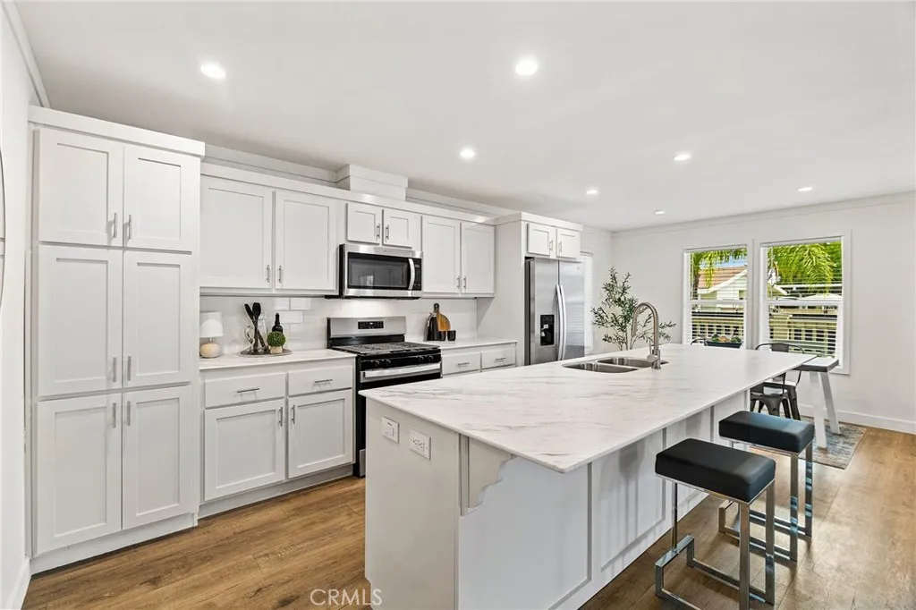 1901 Dayton, Unit 2 Chico, CA 95928 - Photo 14 of 48 a kitchen with white cabinets and white appliances