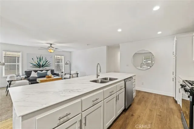 a view of a kitchen counter space and a sink