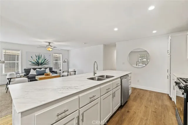 a view of a kitchen counter space and wooden floor