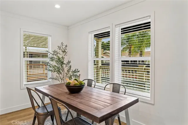 a view of a room with a table and chairs