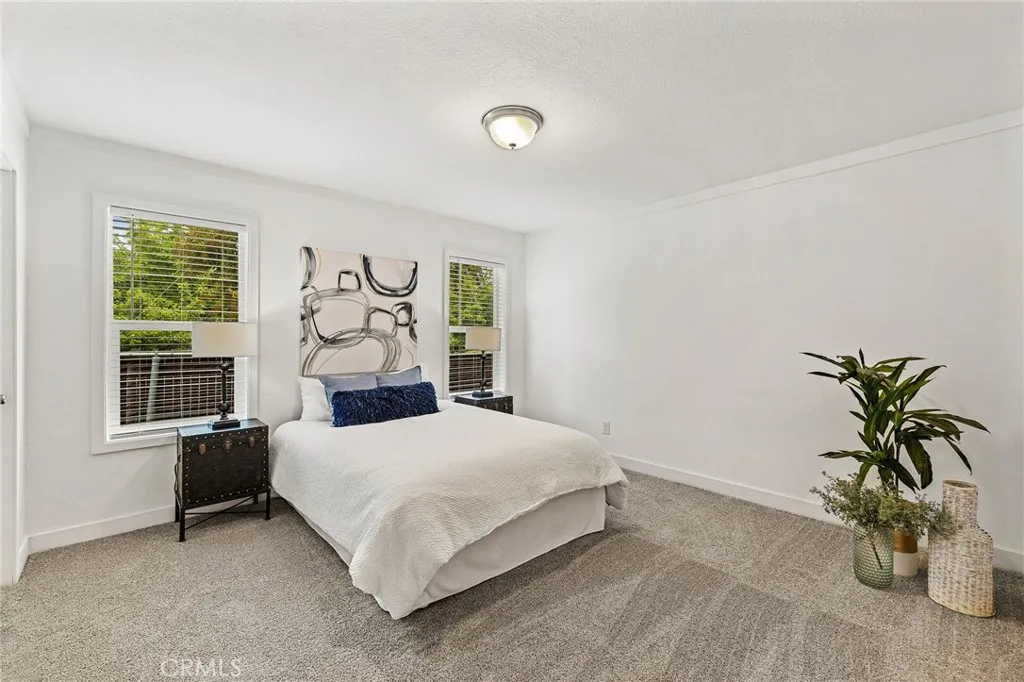 1901 Dayton, Unit 2 Chico, CA 95928 - Photo 23 of 48 a bedroom with a bed table and a window