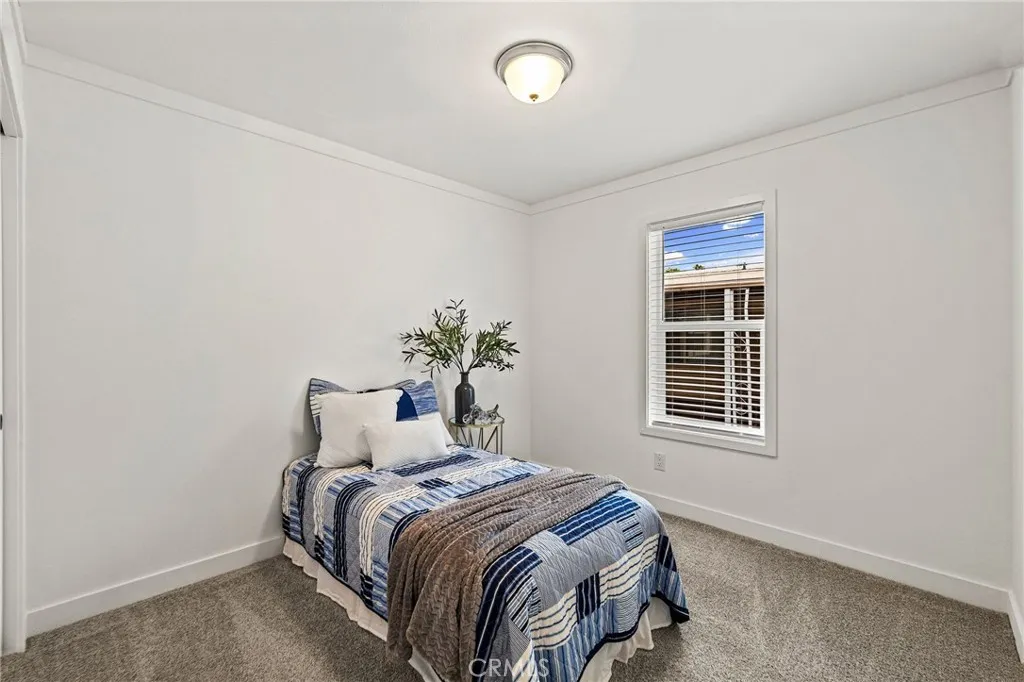 1901 Dayton, Unit 2 Chico, CA 95928 - Photo 30 of 48 a bedroom with a bed and a window