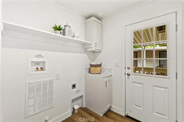 a view of an entryway with wooden floor