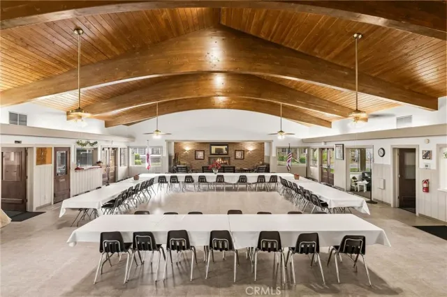 a room with gym equipment and large window