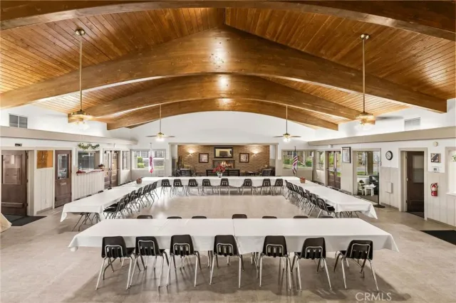 a view of a patio with table and chairs