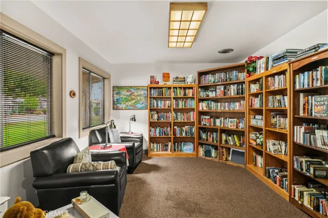 a view of a swimming pool with lounge chairs