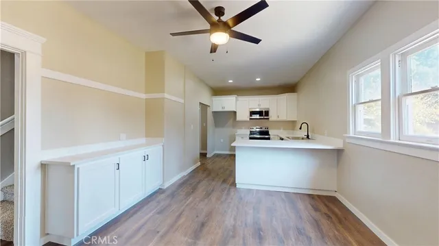 a kitchen with a refrigerator and a sink